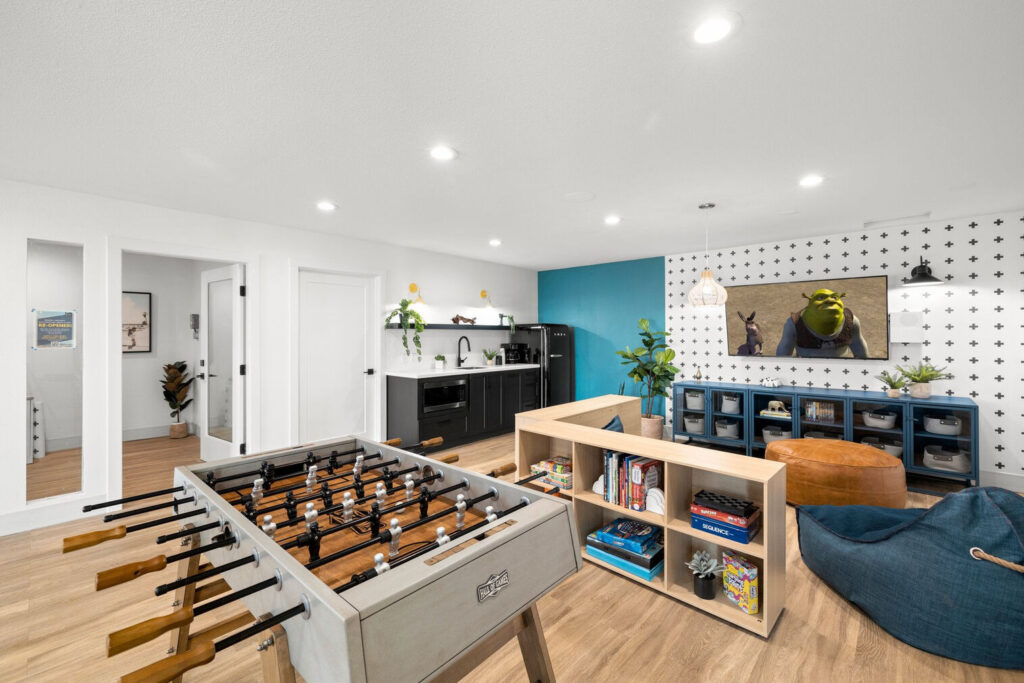 Kids club with foosball table and seating at Lake Crest apartments for rent in Milwaukie